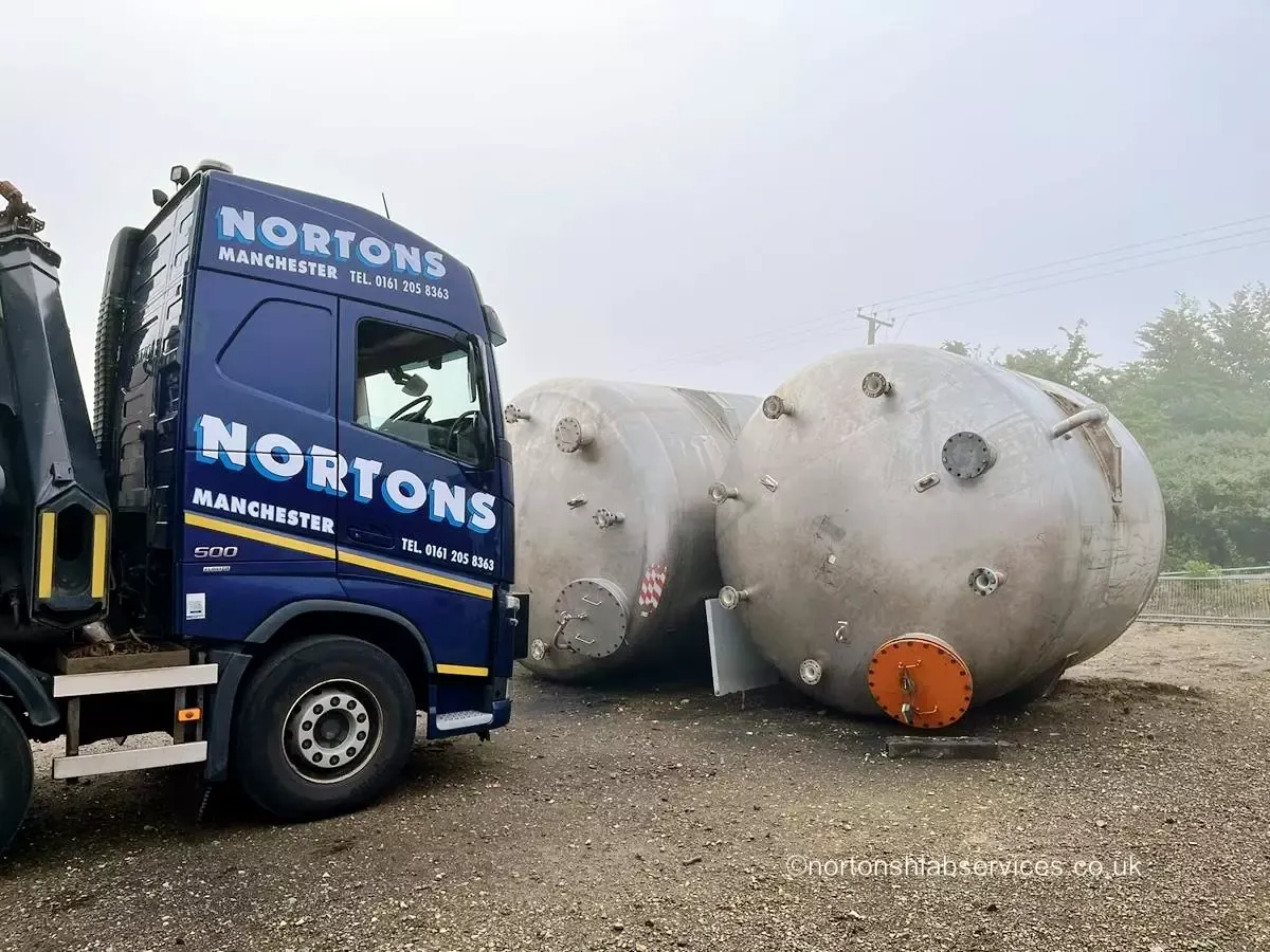 Nortons hiab lorry alongside large steel pressure vessels ready for an abnormal load movement
