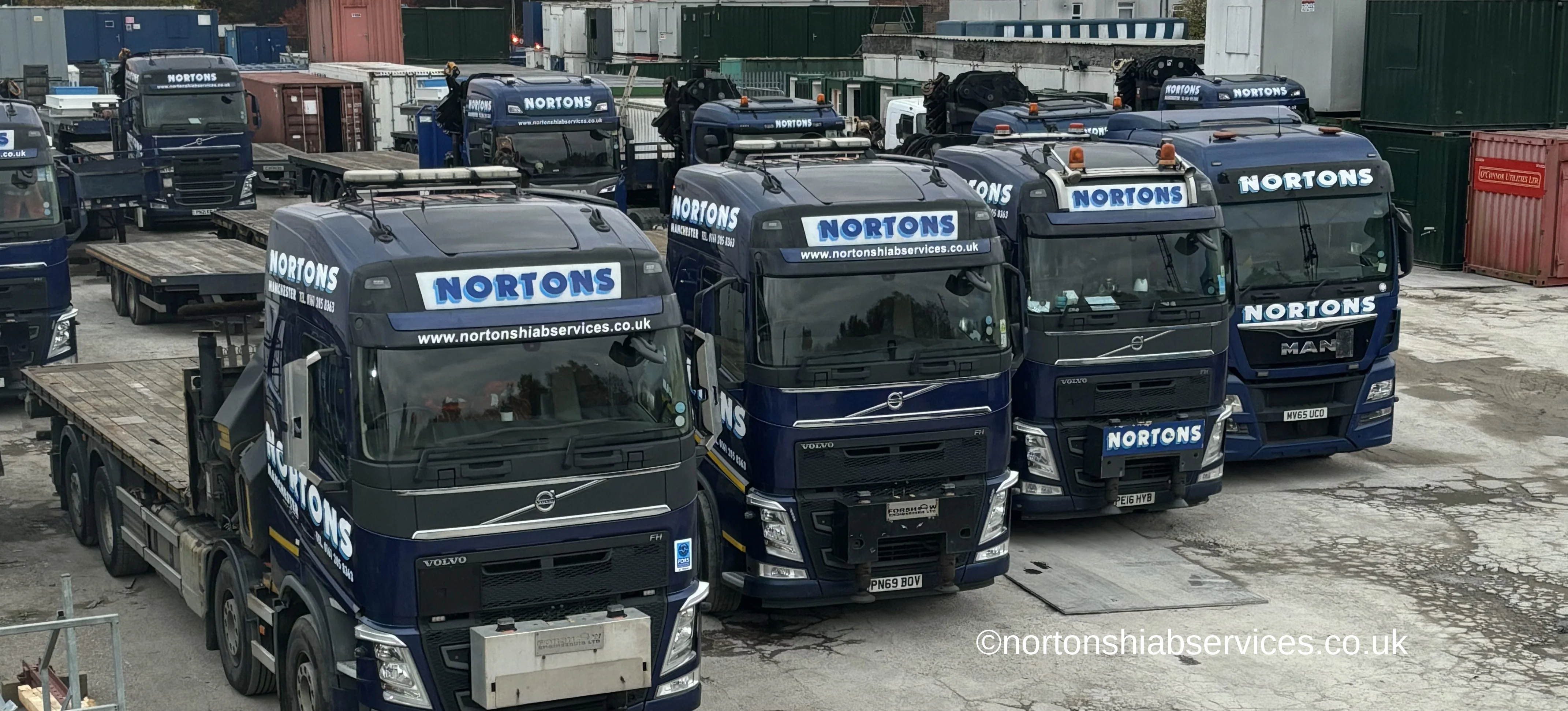 Nortons hiab lorries lined up in the company yard at Miles Platting in Manchester