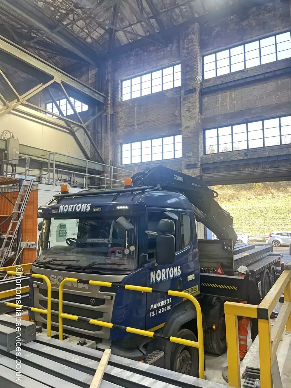 Bundle of structural steel beams loaded on a Nortons hiab lorry
