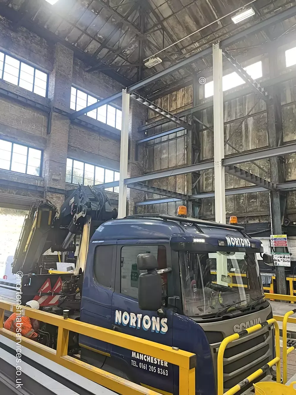 Steel beam being landed onto padstones