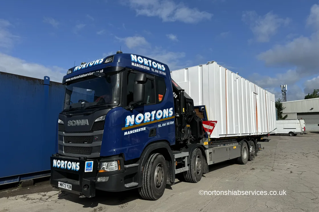 Portable cabin loaded on a Nortons rigid, ready for the road