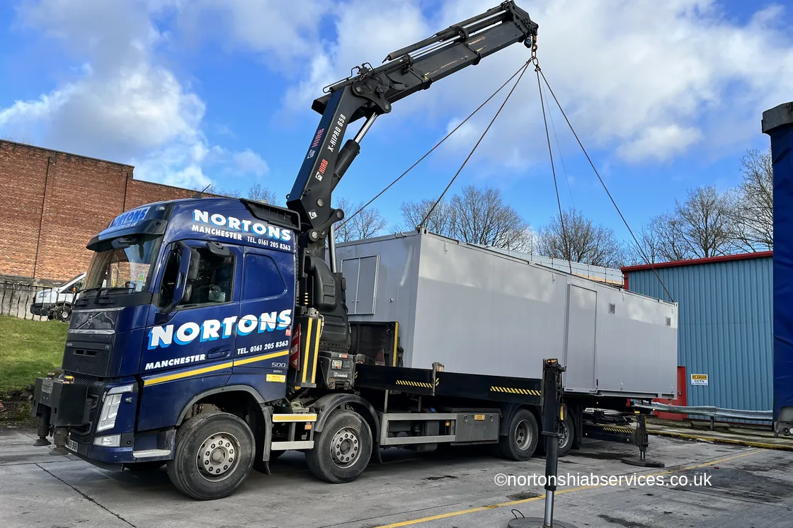 Refurbished site cabin slung and loaded on a Nortons hiab lorry