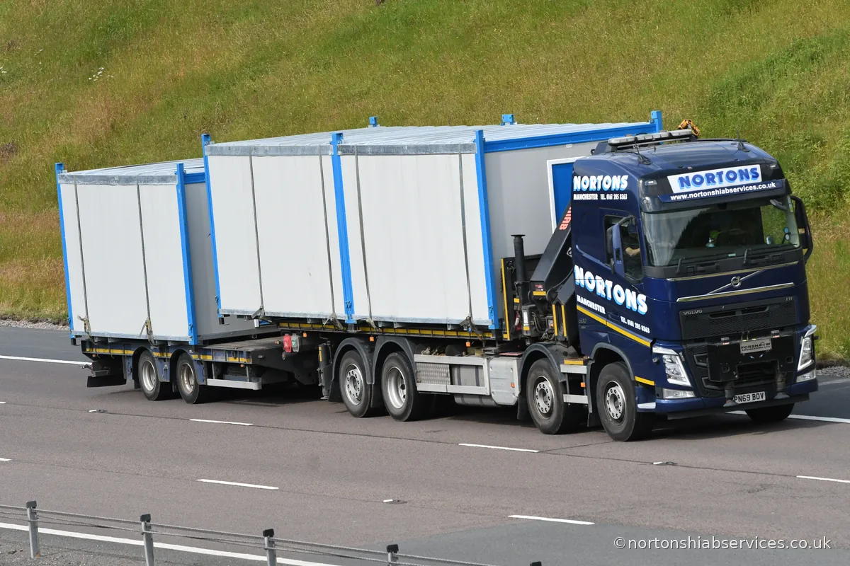 Portable cabin being relocated between sites by a Nortons hiab