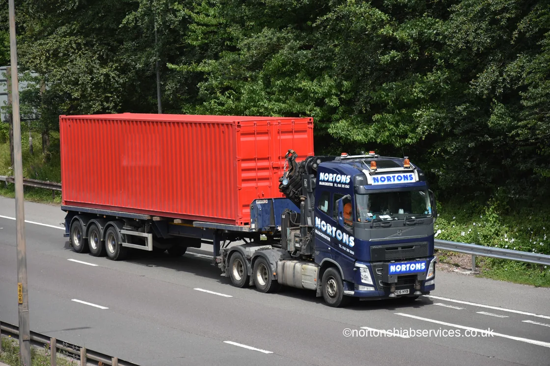 Nortons hiab artic carrying a 40ft shipping container on the motorway