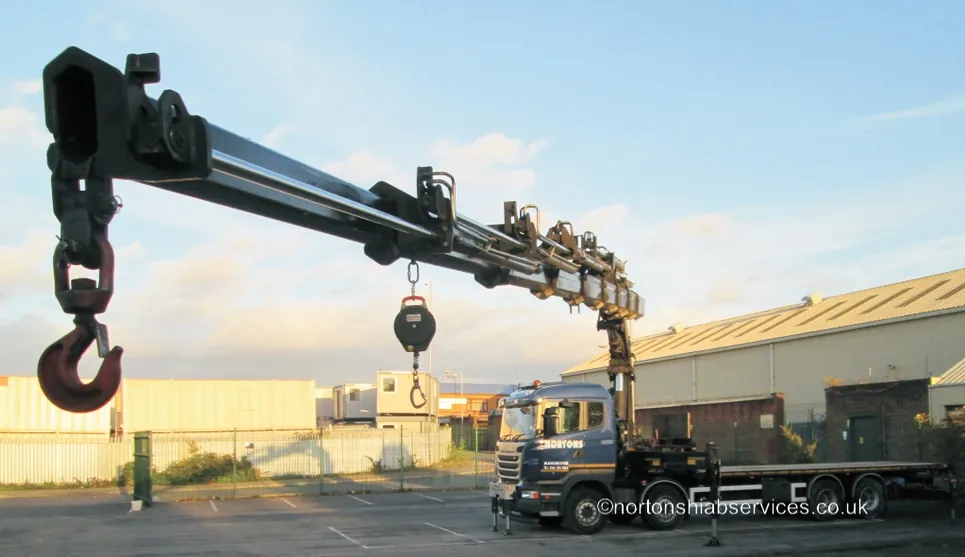 Nortons truck-mounted crane with the boom extended and hook lowered