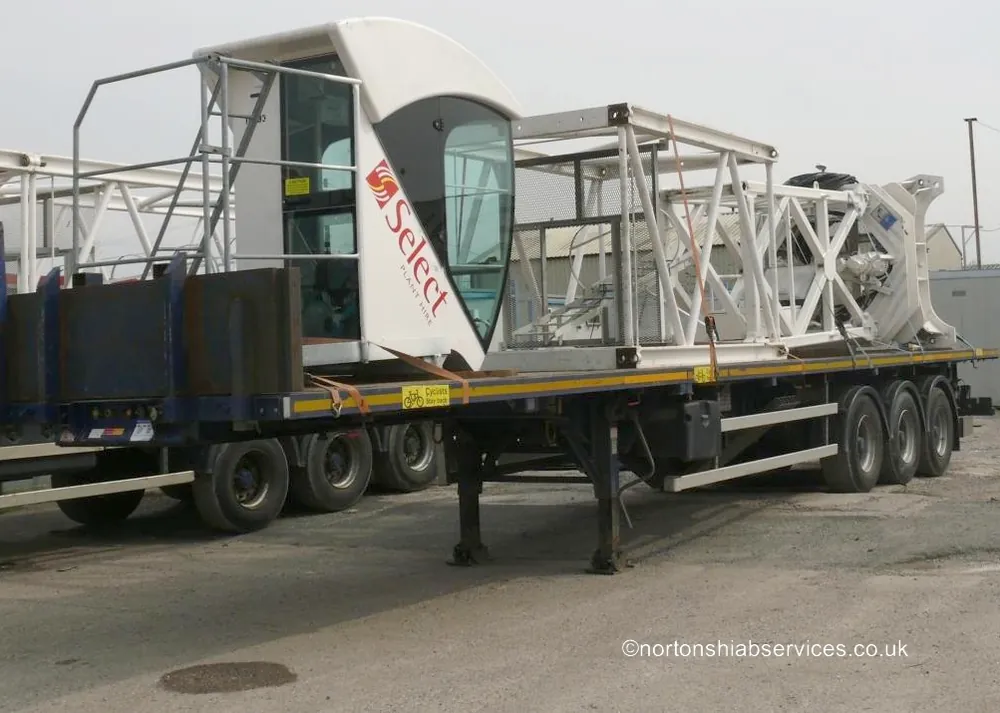 Nortons trailer loaded with tower crane jib sections