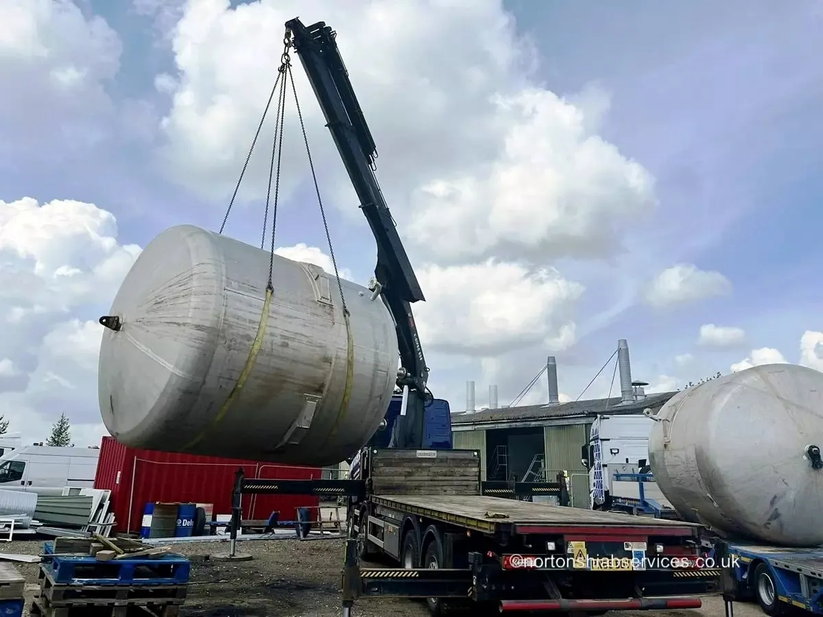 Nortons truck-mounted crane lifting a large steel pressure vessel