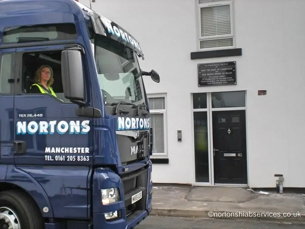 A Nortons driver in the cab of the tractor unit on Canada Street, Manchester