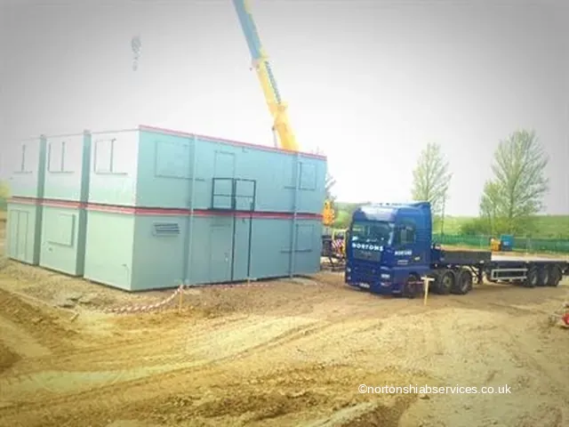 Nortons hiab placing a site cabin onto its position