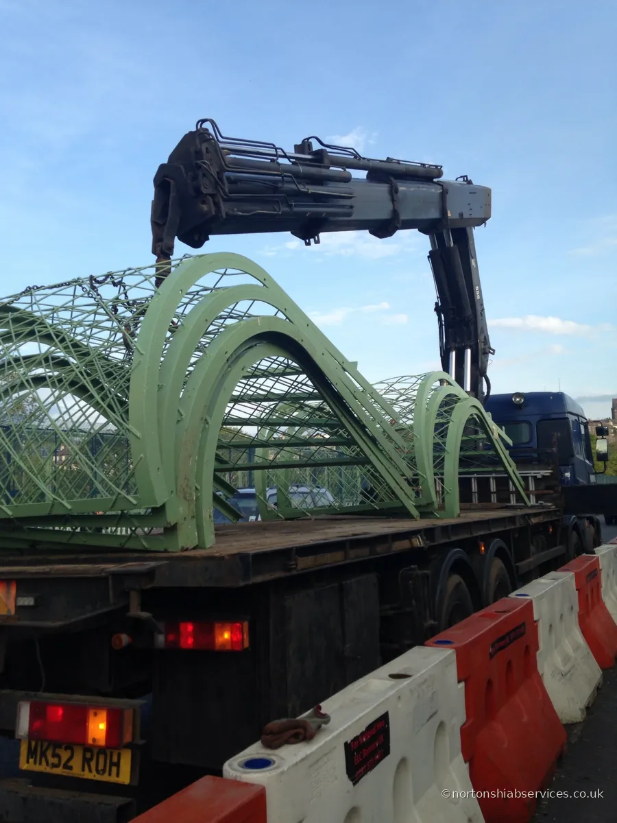 Nortons hiab loaded with a large curved steel arch section