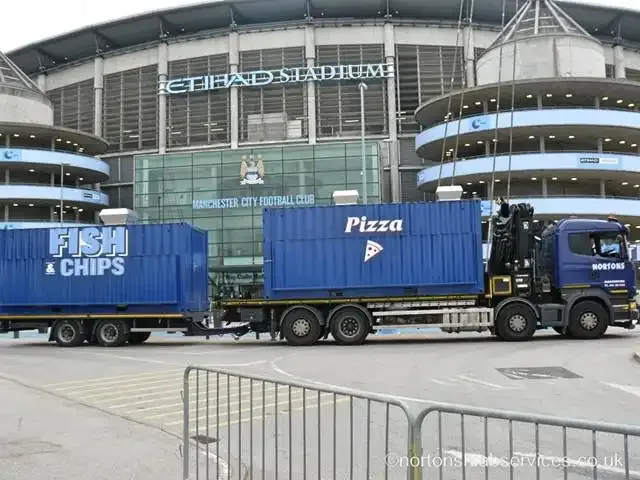 Nortons vehicle with container kiosks outside the Etihad Stadium in Manchester