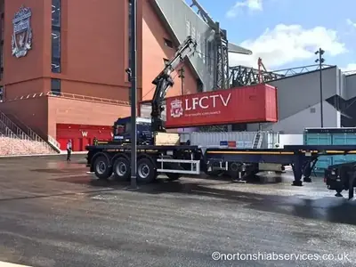 Nortons articulated hiab with a red container unit at the Liverpool Football Club site