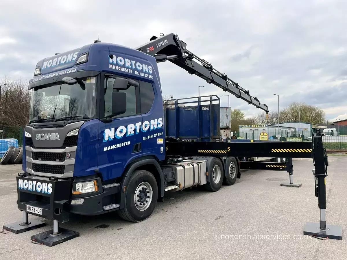 Nortons articulated tractor unit coupled to a 45ft flatbed semi-trailer with the crane stowed