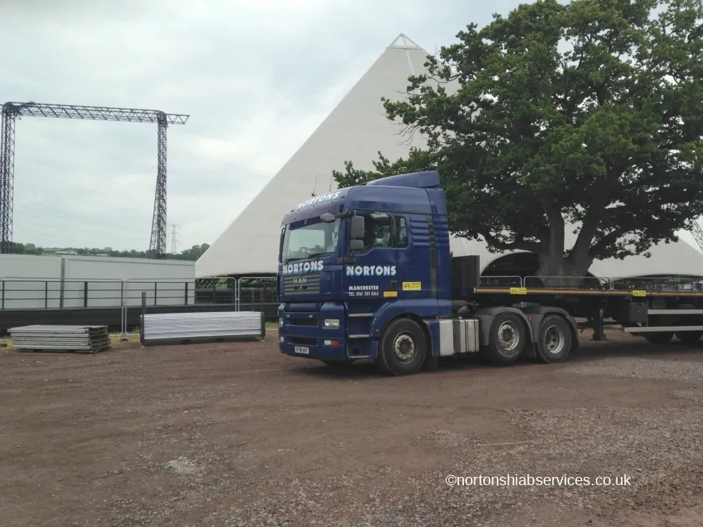 A Nortons lorry waiting at the site gate at the Glastonbury festival ground