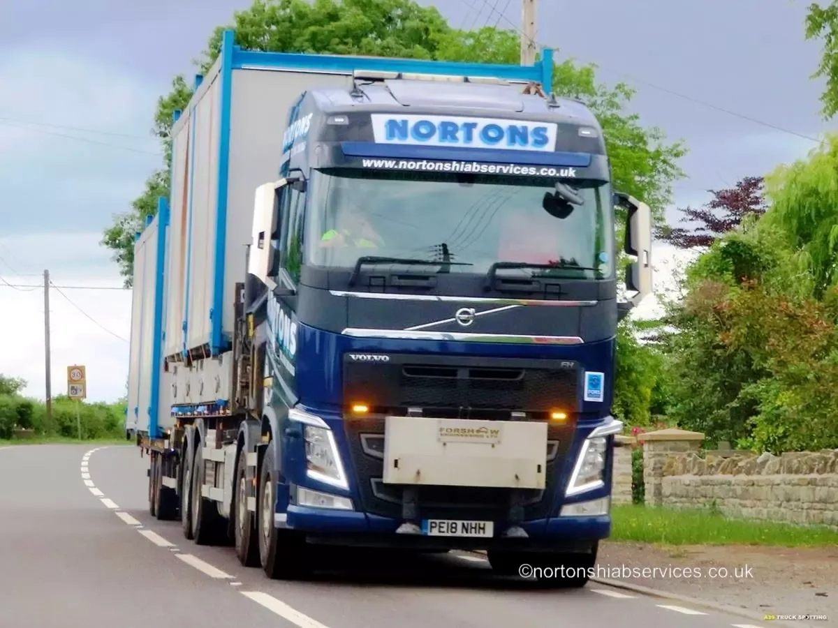 A Nortons lorry on a narrow Somerset lane on the approach to the festival site