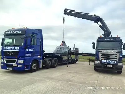 Two Nortons vehicles on the apron at Blackpool Airport during the helicopter movement