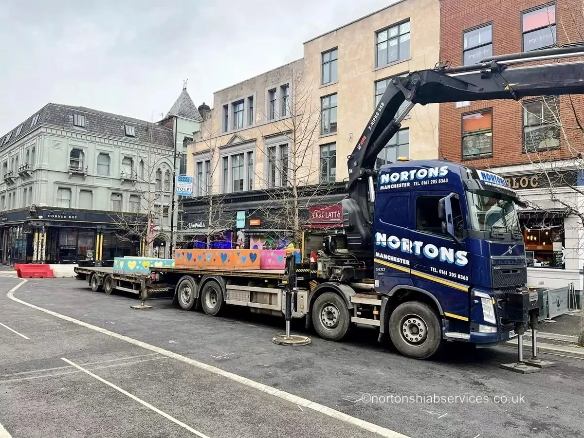 Nortons hiab working in a Manchester city centre street with traffic management