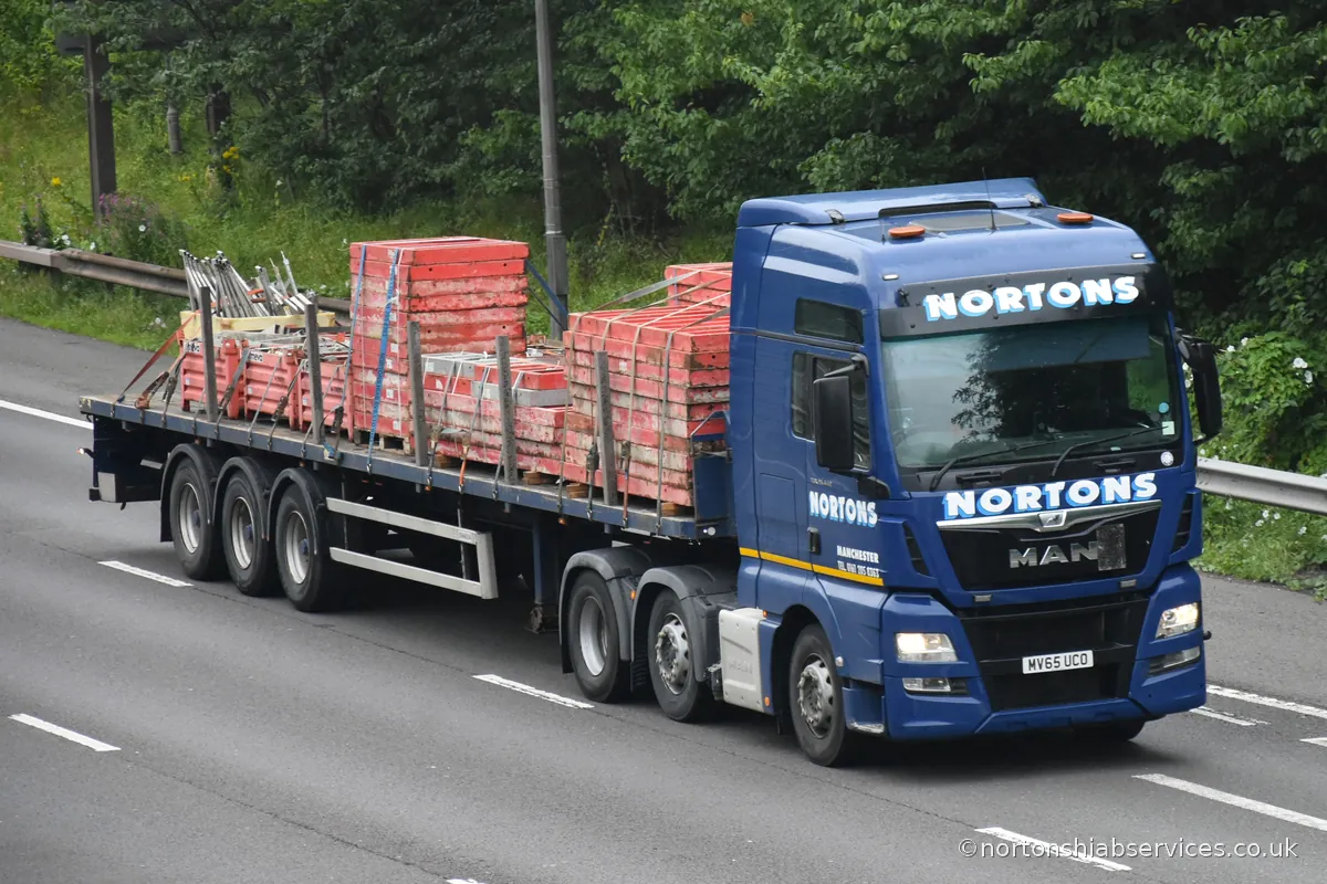 Nortons articulated flatbed carrying brick packs on the M6 motorway