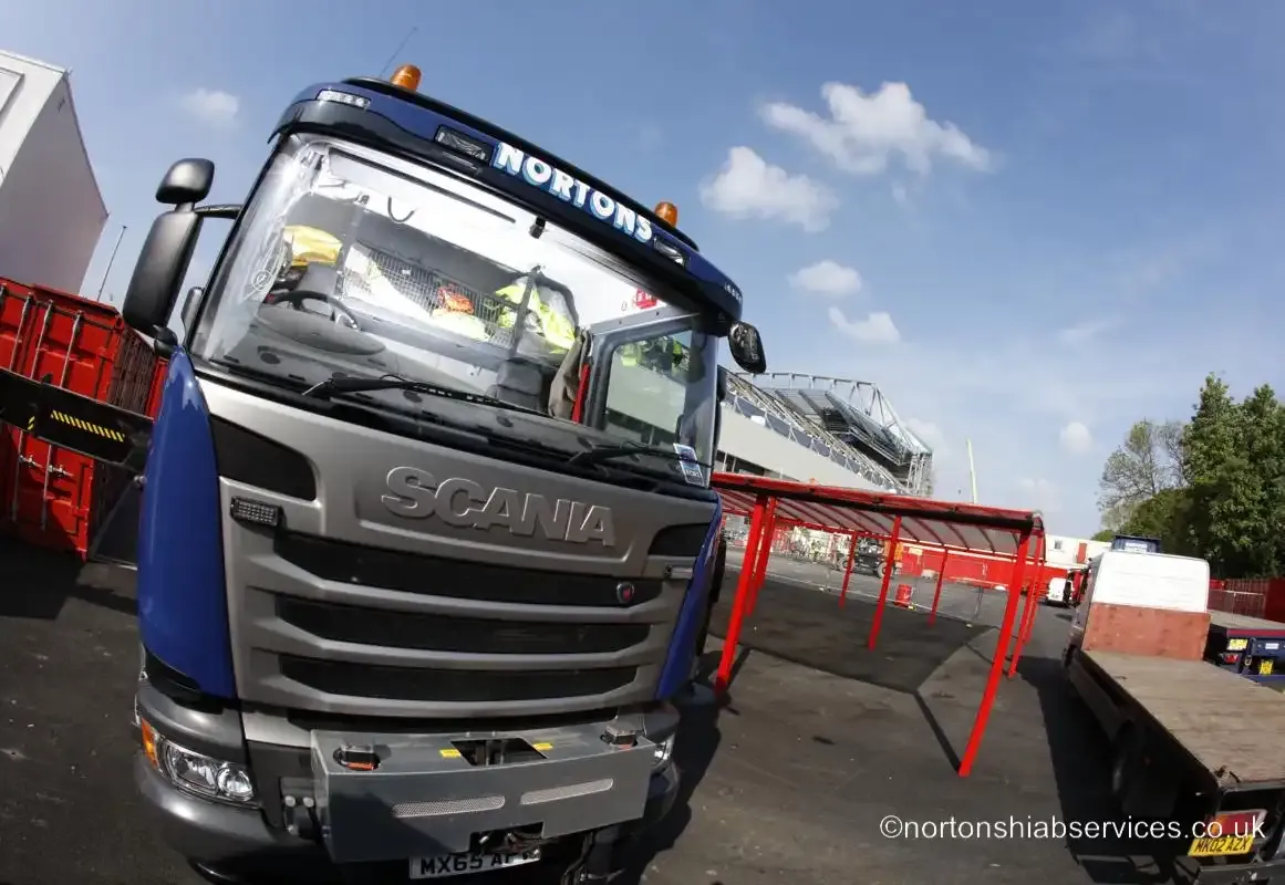 A Nortons Scania hiab loaded with a site unit outside the Anfield stadium works in Liverpool