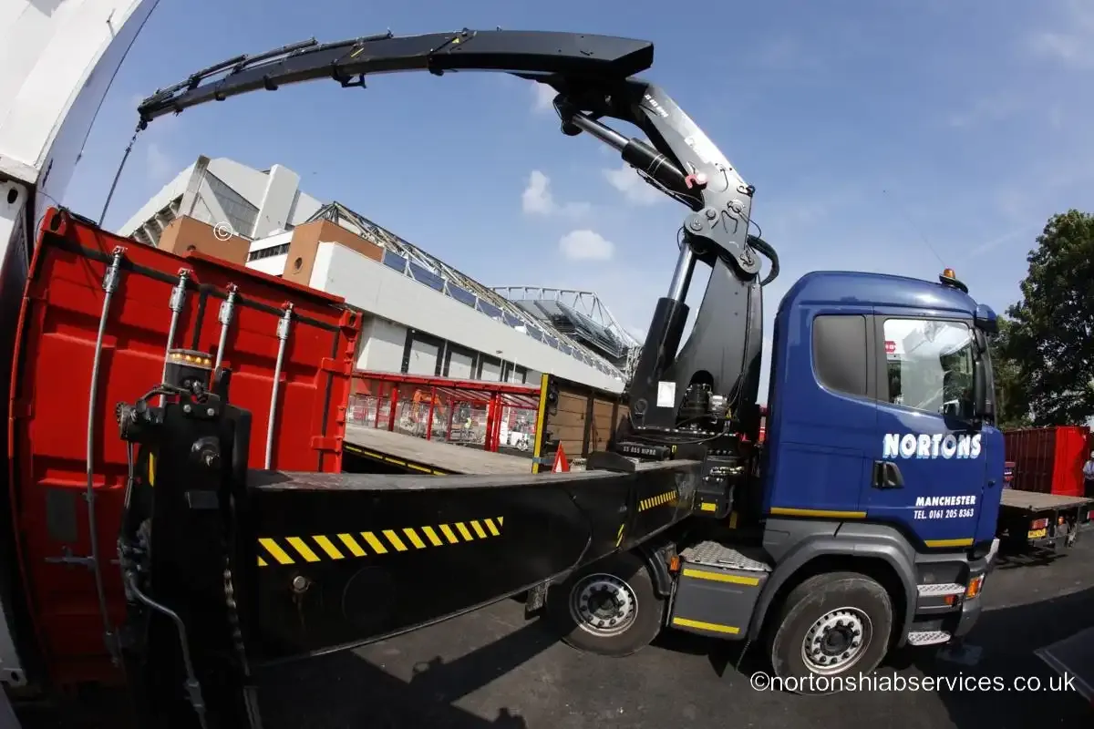 A Nortons Scania hiab set up on the street outside the Anfield stadium works