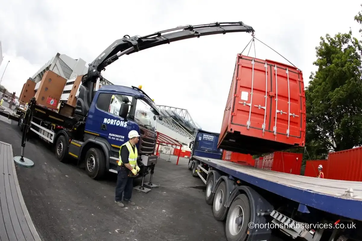Nortons operatives checking a landed site unit before releasing the slings at Anfield