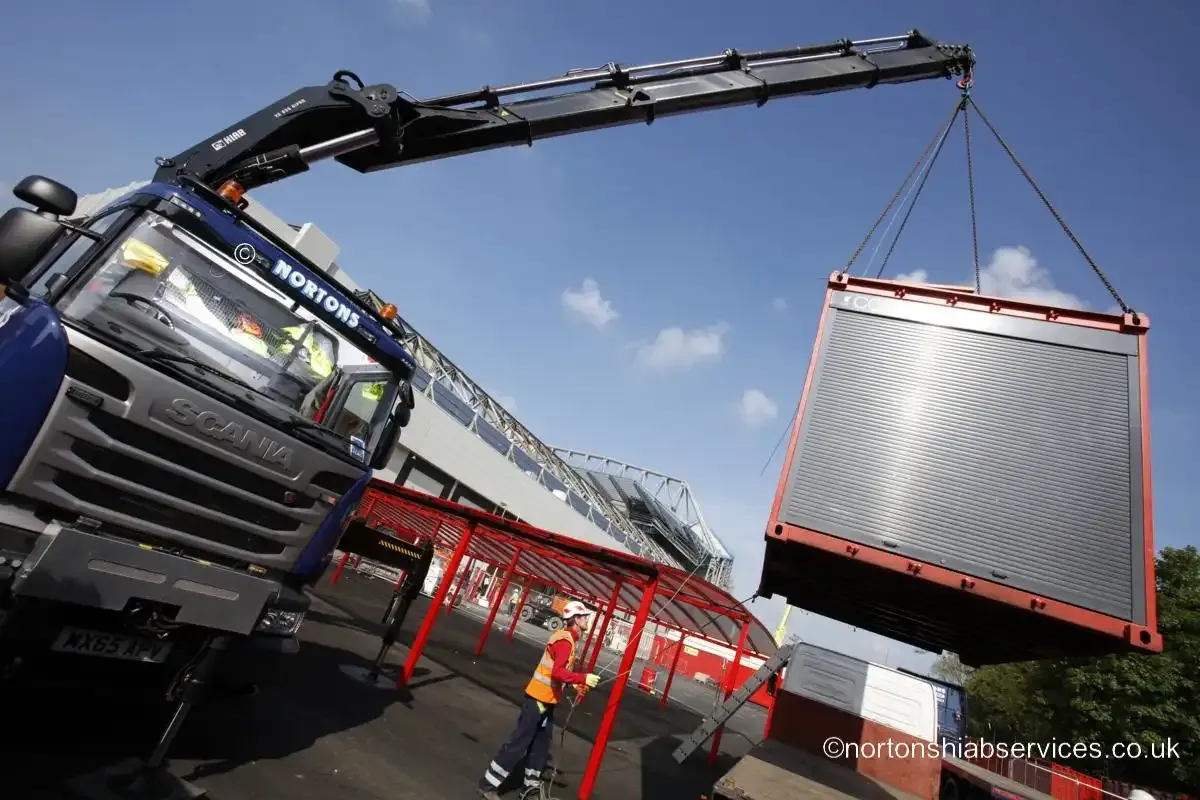 A site unit on the slings with a Nortons banksman watching the load at Anfield