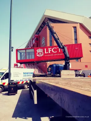 The studio unit lifted clear of the trailer on four slings with the crane at full height