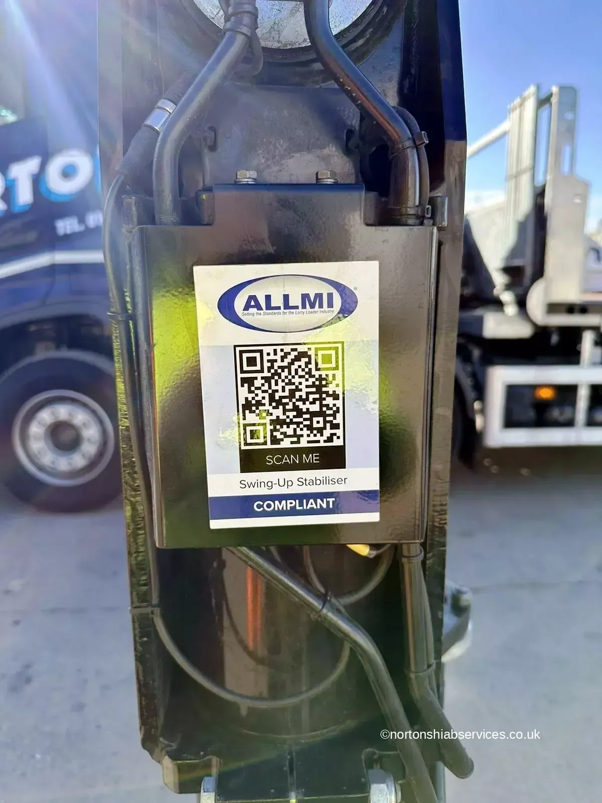 ALLMI swing-up stabiliser compliance label on a Nortons loader crane