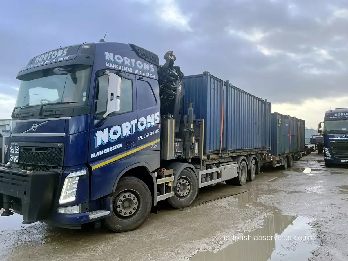 Nortons wagon and drag loaded with two site containers