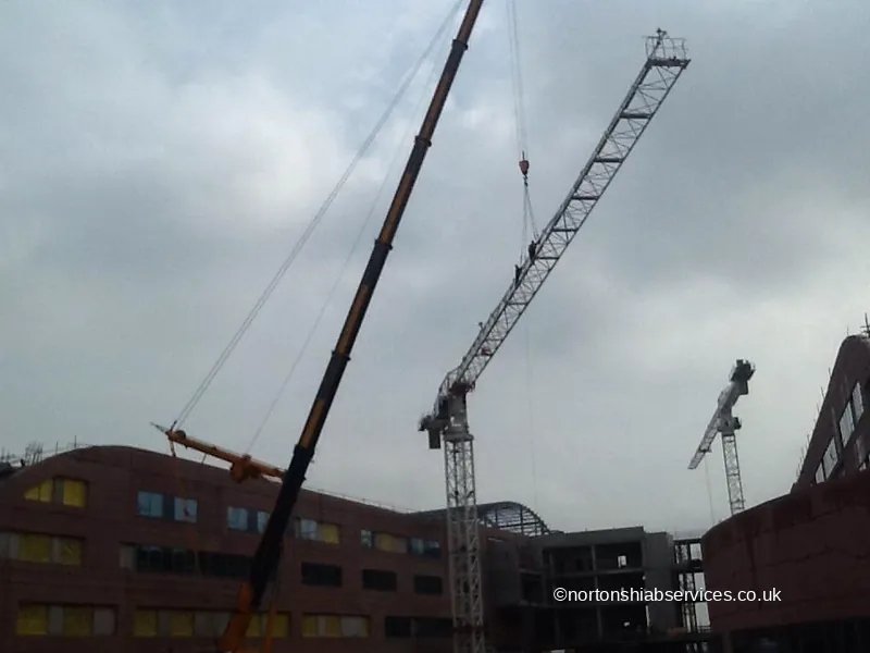 Tower cranes over a city-centre construction site