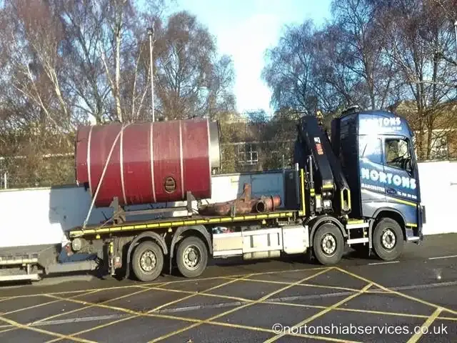 Large steel tank loaded on a Nortons lorry loader