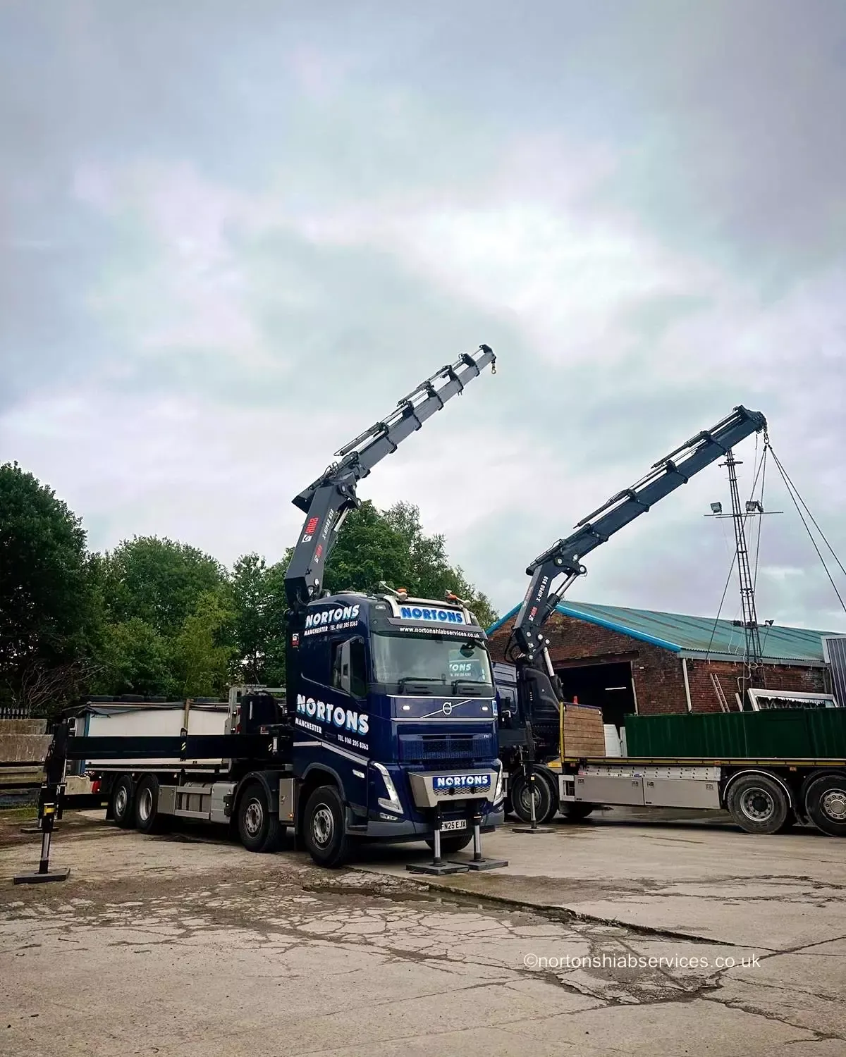 Two Nortons loader cranes working together in the yard