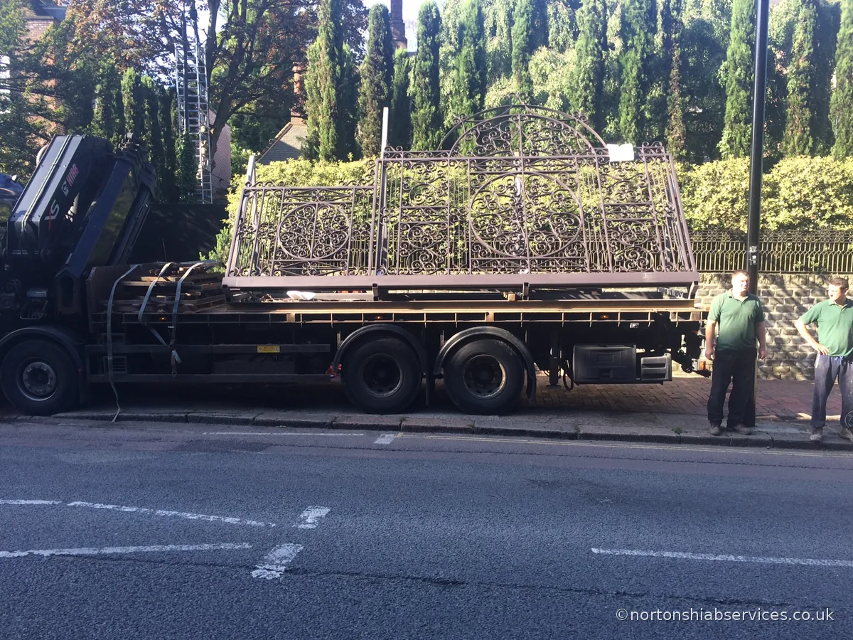 Long fencing panels loaded flat on a Nortons hiab lorry