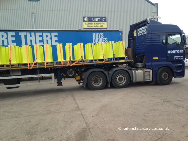 Railway sleeper posts loaded on a Nortons flatbed lorry