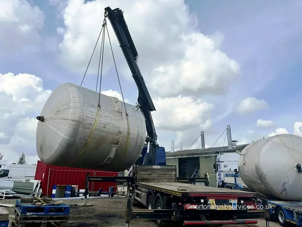 Nortons hiab lifting a long vessel onto a trailer