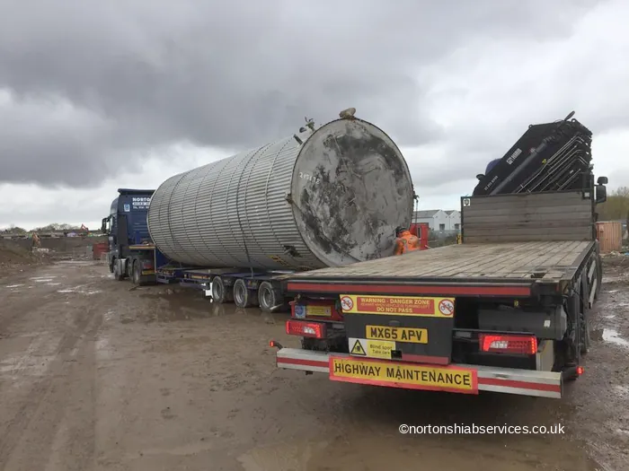Large steel vessel carried on the low deck of a Nortons trailer