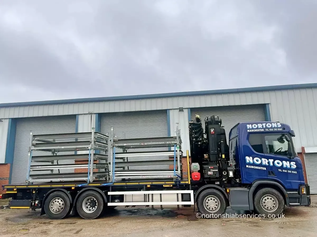 Nortons 858 hiab loaded with steel stillages outside a Manchester unit