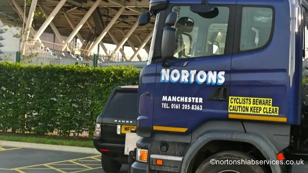 A loaded Nortons hiab lorry on the approach road to the Manchester City football academy site