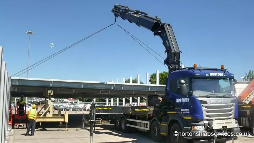 Nortons hiab lorry delivering structural steelwork at Manchester Airport