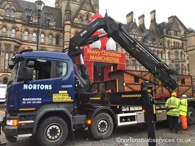 Nortons lorry with a Merry Christmas Manchester banner at the Christmas markets