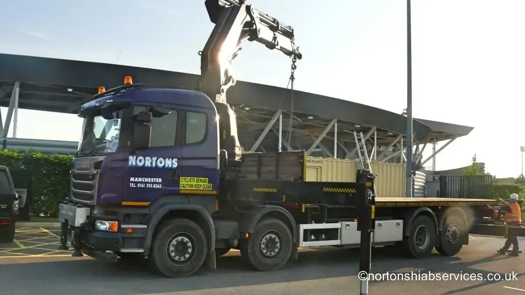 Nortons eight wheeler alongside a cabin at the Manchester City Academy development