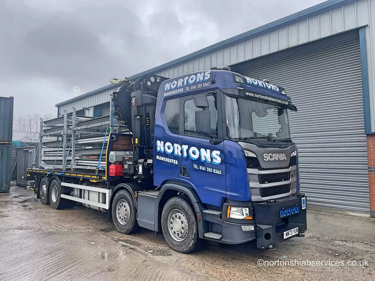 Nortons flatbed lorry loaded with stillages outside the Manchester depot