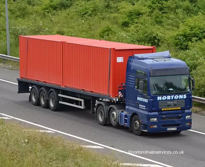 Nortons artic carrying a container on the M5 at Strensham