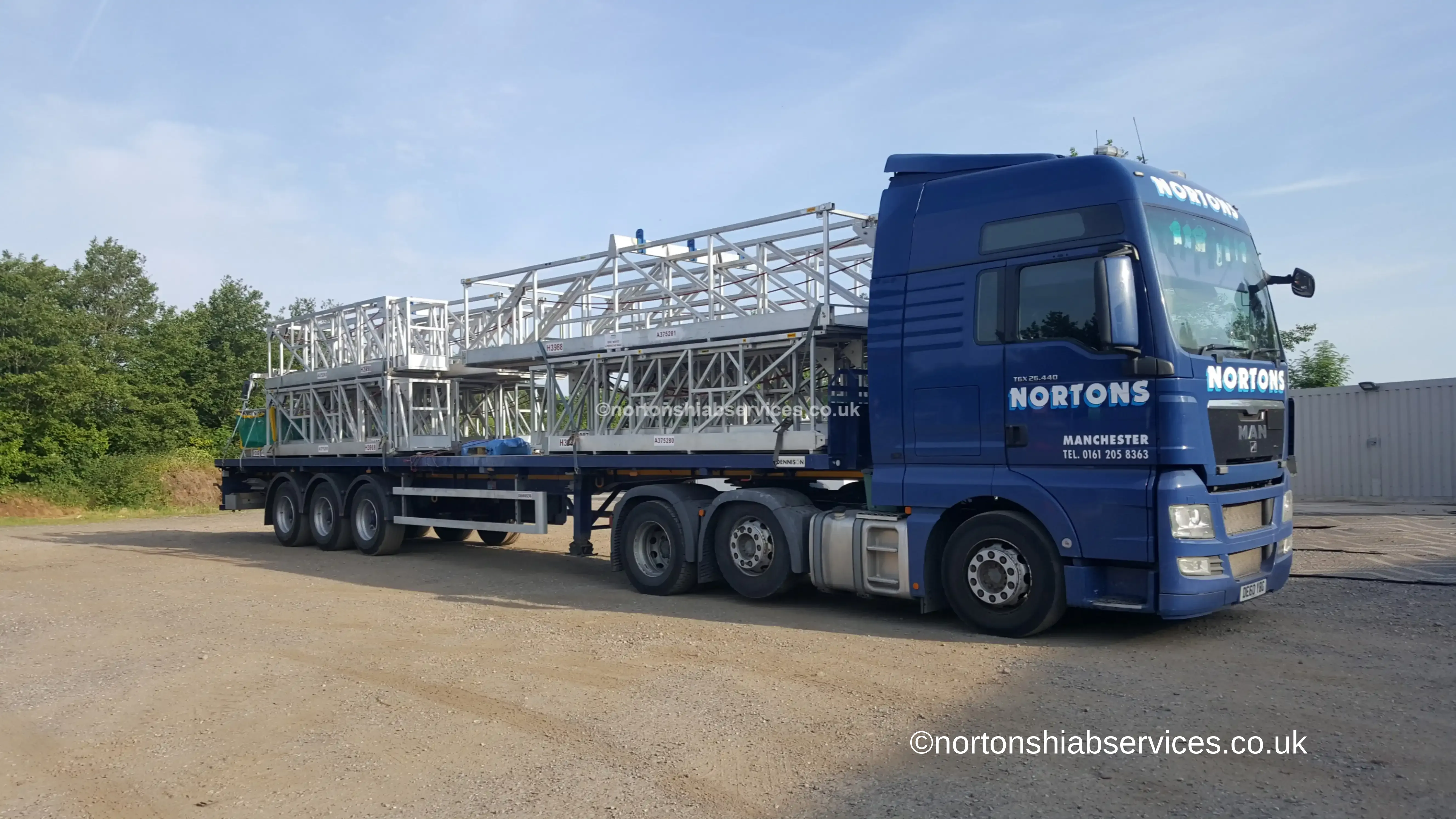 Nortons artic loaded with an access platform on the run into Manchester