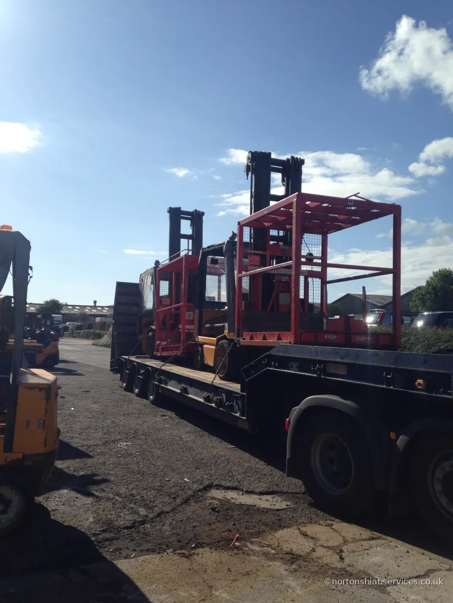 Nortons trailer loaded with steel stillage cages at Risley