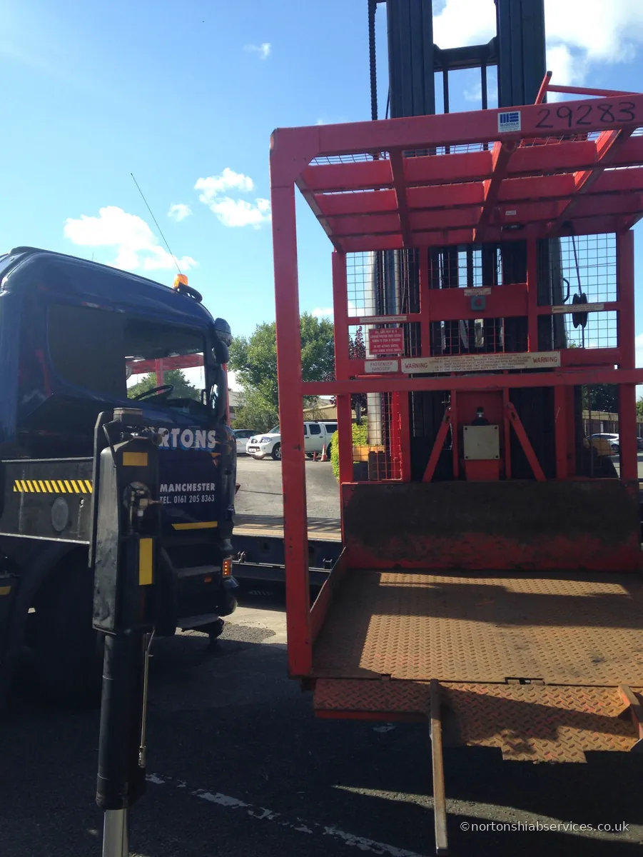 Nortons hiab lifting a forklift truck onto a flatbed at Risley