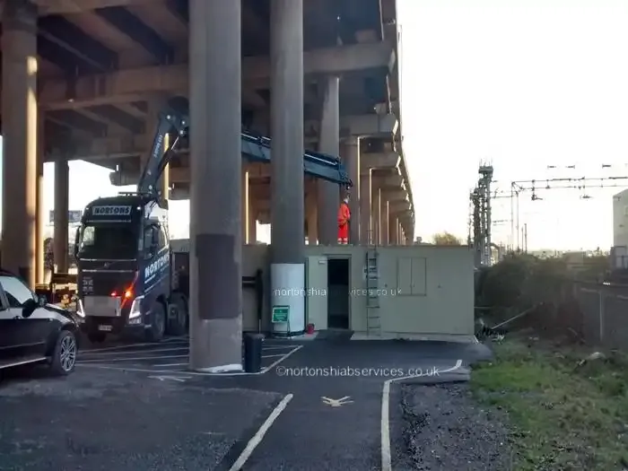 A Nortons lorry crane positioning a cabin underneath the M5 viaduct at Worcester