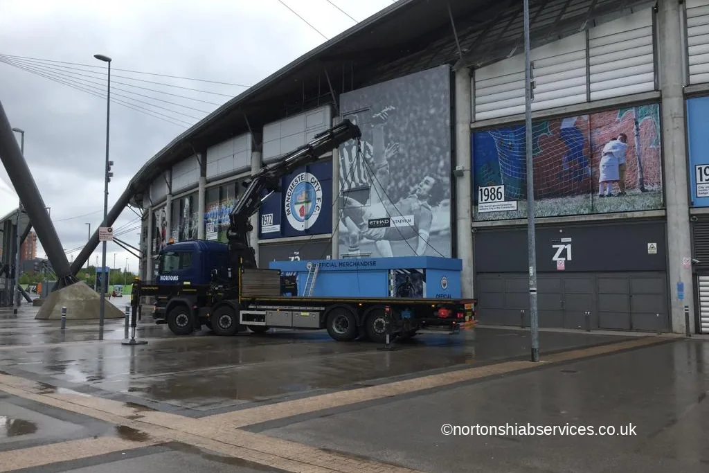 A Nortons hiab lorry with a matchday store unit at the Etihad Stadium