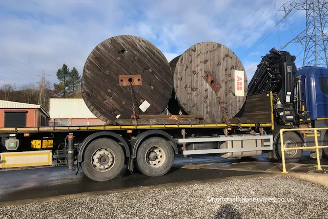 Two large cable drums loaded on a Nortons flatbed at Tameside