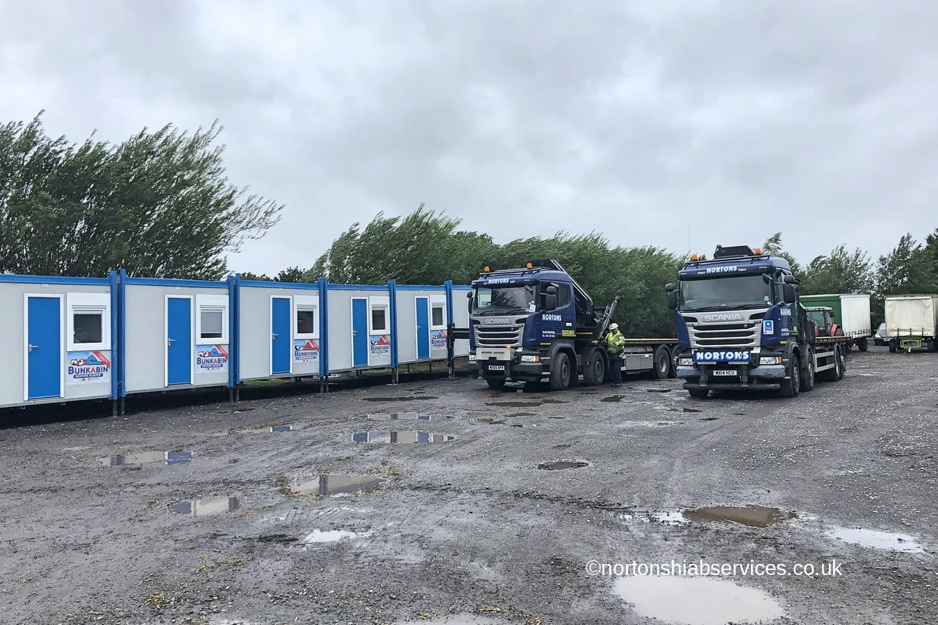 A row of blue and white accommodation cabins delivered by Nortons at Hesketh Bank